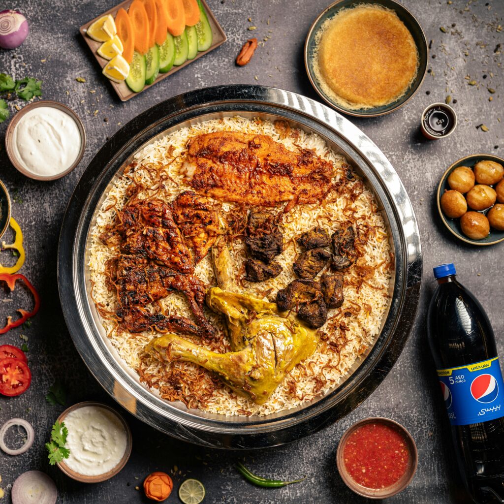 pexels-photo-18698264-18698264 A vibrant still life of an Arabic Mandi dish, featuring delicious grilled meats with fragrant rice.